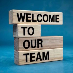 Blocks in a pile with the words written on them - Welcome to our Team