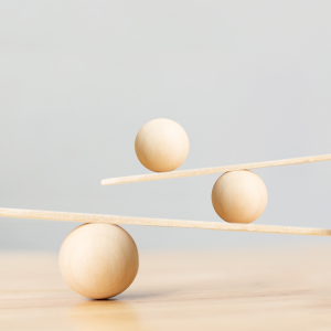 2 planks of wood balancing on 3 balls