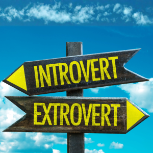 arrows pointing opposite directions saying introvert and extrovert