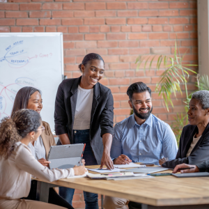 group of coworkers sitting around a desk
