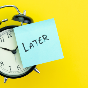 Clock with a post-it note saying later