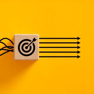Abstract Image - swiggly lines entering a block of wood with a bullseye emerging in straight lines